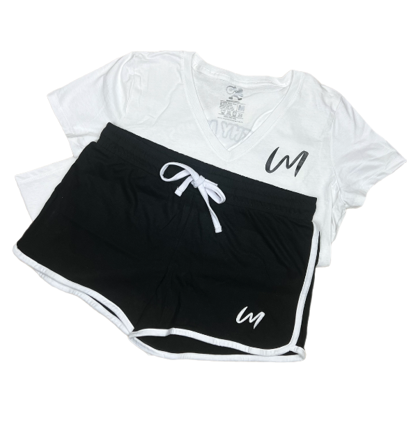 This stylish glow shorts set is designed for confident women who are determined to manifest success in every aspect of their lives. The white v-neck shirt and colored shorts front design features our brand name initials with our brand name in the back. The glow shorts are available in red, pink, navy and black.